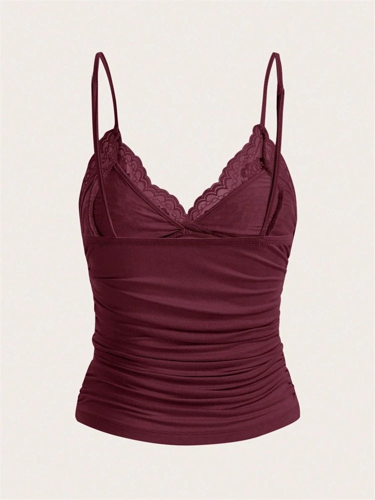 Top corto con encaje y moño frontal